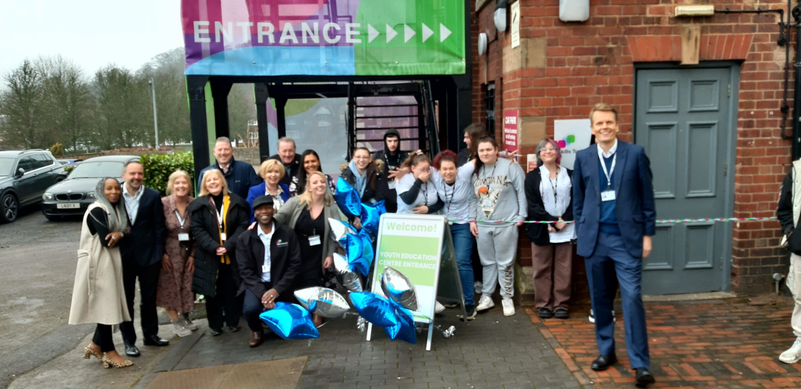 Skills Training UK CEO Guy Ballantine outside the Dudley Centre, Priory House with the team and learners who are currently on programme.